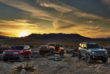 3 bronco vehicles in the sunset