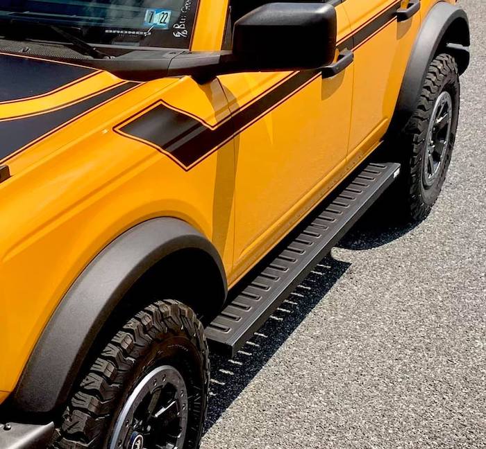 Orange bronco with running boards