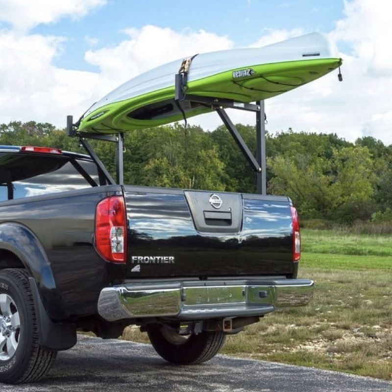 Kayak on Nissan truck with cover